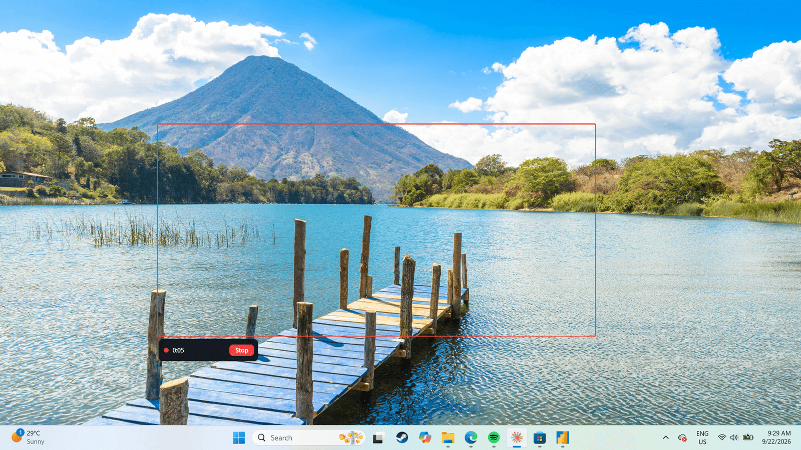 A region of the Windows desktop outlined in red while recording, with a small bar showing elapsed time and a Stop button.